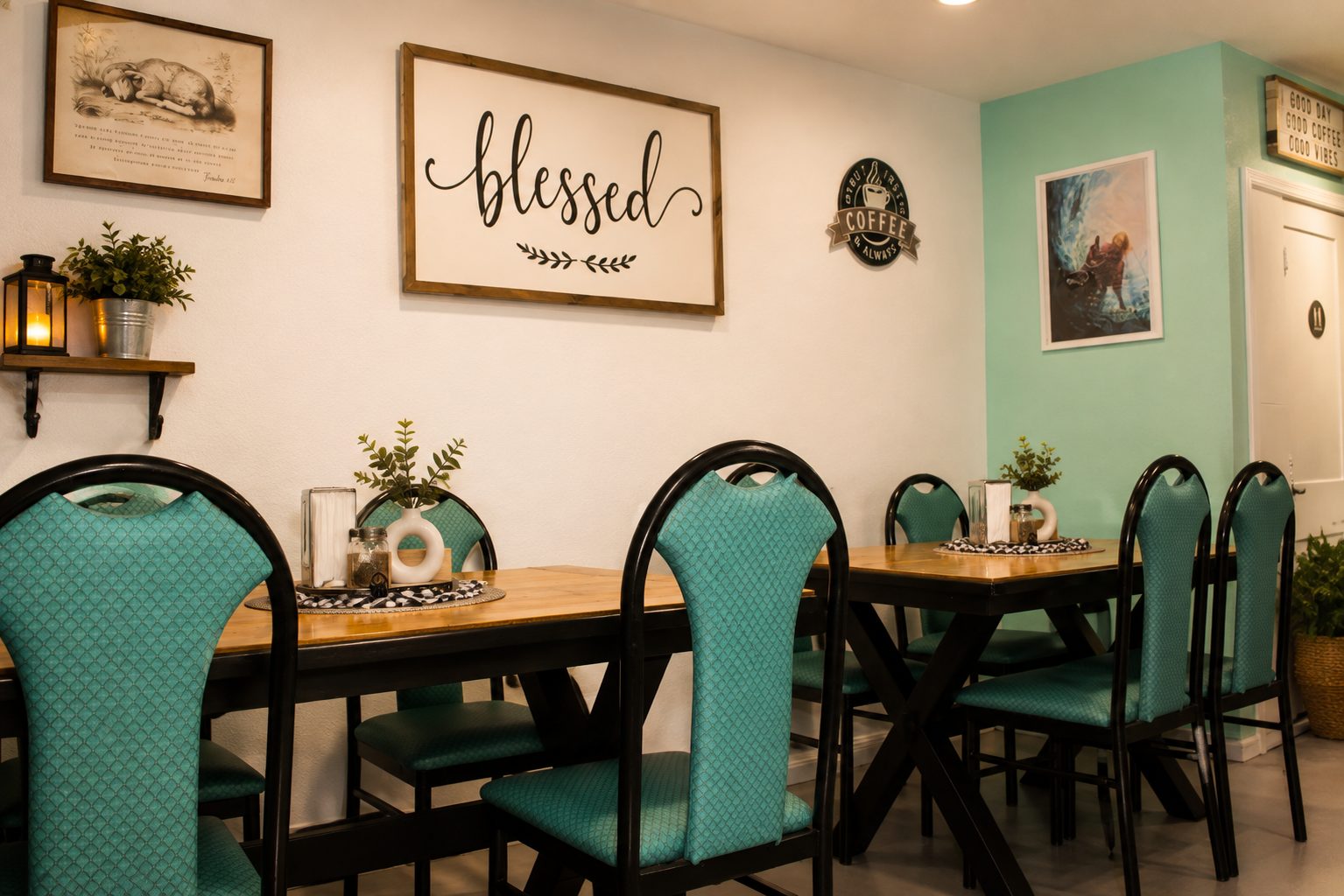 Dining room with farmhouse tables, teal chairs and a “blessed” sign on the wall
